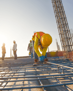 Wide view of a construction site with workers actively on the job
