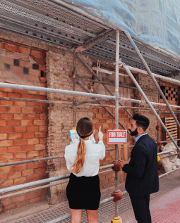 General contractors discussing and planning construction work on site