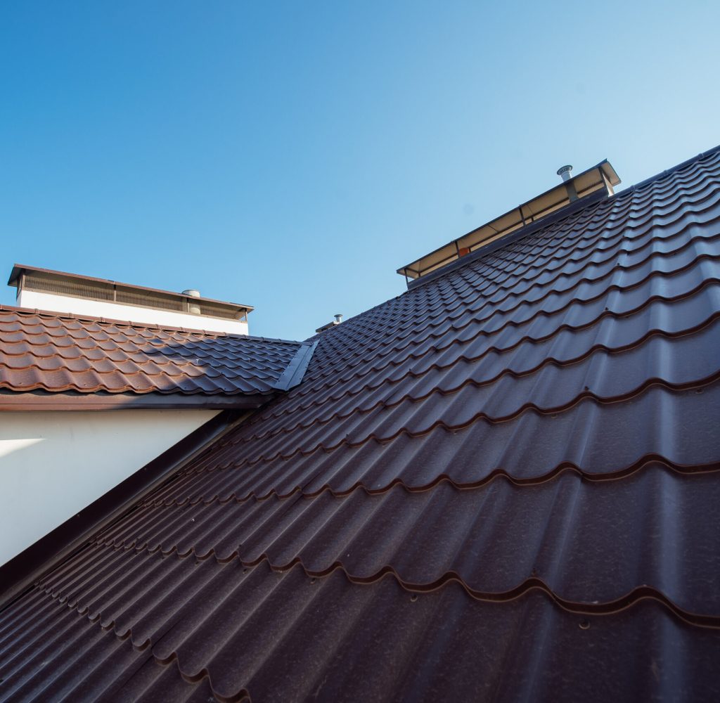 Tile Roof of a two-story white cottage Tile Roof of a two-story white cottage
